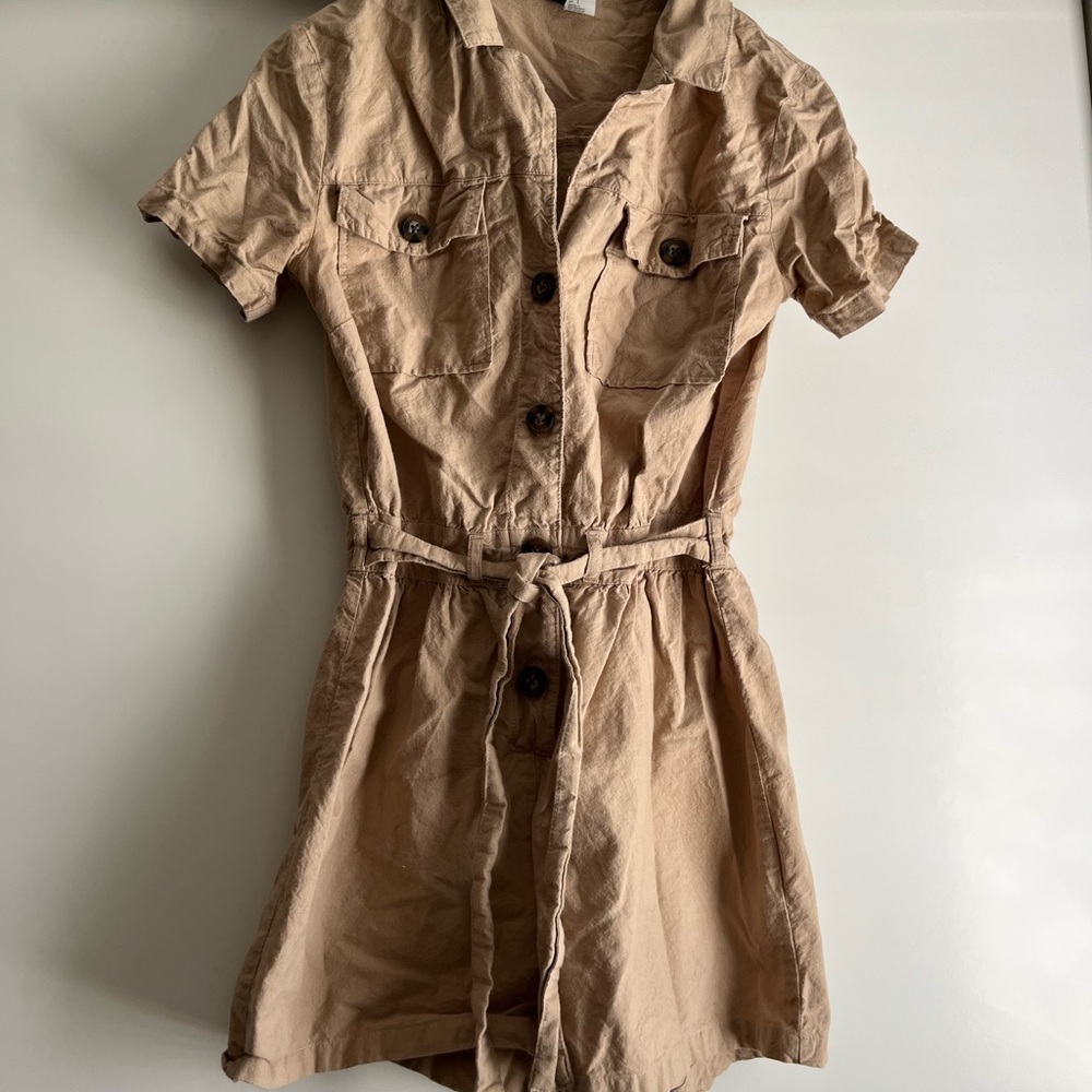 Shorts jumpsuit outfit in tan